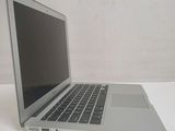 a laptop computer sitting on a table with a white background