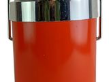 an orange ice bucket with a metal handle on a white background