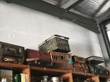 a shelf with many different types of luggage on it