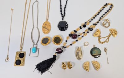 an assortment of jewelry including a necklace, earrings, and brooches