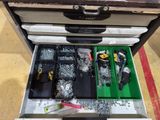 a tool box with tools in it sitting on the floor