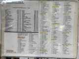 a menu on the wall of a restaurant with a price list