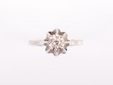 a close up of a diamond ring on a white background