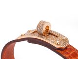 a close up of a brown leather bracelet with a gold clasp