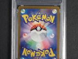a close up of a pokemon card in a plastic case
