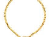 un collier en or avec un pendentif en forme de cœur sur une chaîne