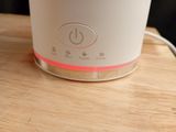 a white blender sitting on top of a wooden table