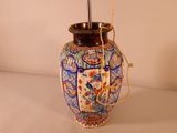 a vase with a handle that has a handle on it