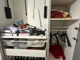 a closet with a lot of clutter in it