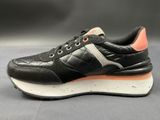 a close up of a pair of black and orange sneakers