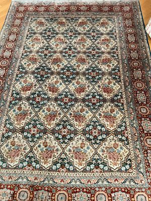 a close up of a rug on a wooden floor in a room
