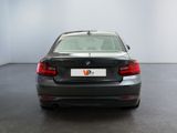 the back of a car is shown in a room with white walls