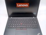 a laptop with a lenovo logo on the screen