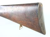 an old rifle with a wooden barrel and brass fittings on a white background