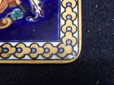 a picture of a blue and yellow tile with a monkey on it