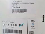 a white box with a black and blue sticker on it