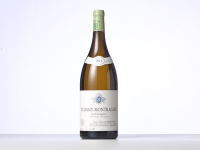 the bottle of wine is sitting on the table with a white background