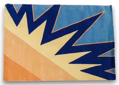 a close up of a blue, yellow and orange rug on a white background