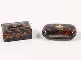 pair of tortoises in a box and a small box with a cross on it