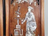 pair of antique chinese carved wood plaques of a lady and a man