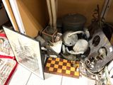 a pile of assorted items sitting on a tiled floor