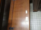 a wooden chest sitting on the floor in a room