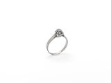 a close up of a ring with a diamond on it