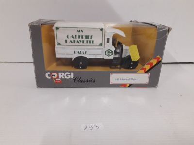 toy truck in a box on a white surface with a white background
