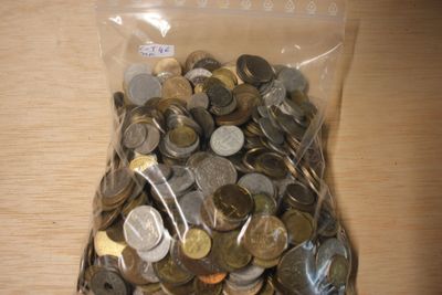 a bag full of coins sitting on a table
