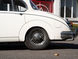 a white car that is parked in front of a building