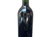 a bottle of wine that is sitting on a table