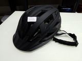 a helmet on a table with a tag on it