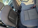 the back seats of a car are black and grey in color