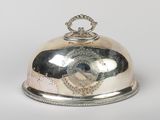 a silver plate with a silver lid on a white background