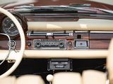 a dashboard of a car with a radio and a steering wheel