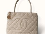 a close up of a chanel bag on a white background