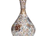 a glass vase with a floral design on it