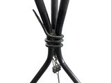 a close up view of a metal table with a bunch of sticks attached to it