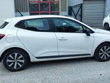 a picture of a white car parked in front of a building