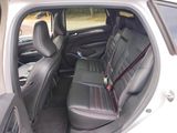 the back seats of a car with a seat belt in the back of it