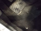a close up of a car ' s floor with a foot rest