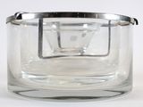 a clear glass container with a silver lid
