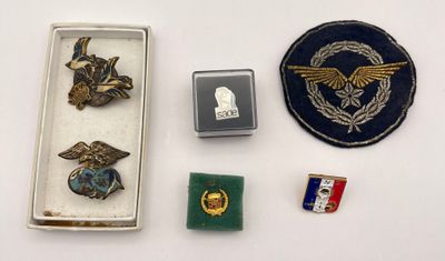 a small box of pins and other items on a table