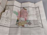 an open book with a map on it on a table