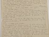 an old piece of paper with writing on it sitting on a table