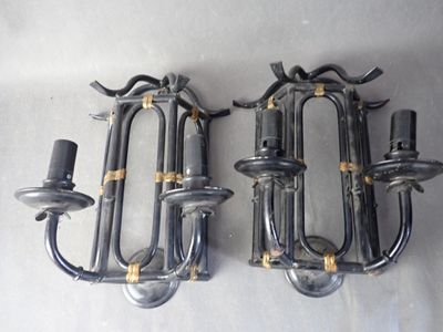 two wall sconces that are attached to the wall