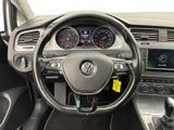 the interior of a car with a steering wheel and dashboard controls