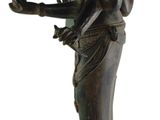 bronze statue of a woman holding a bird and a bird in her hand