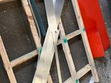 several pieces of wood are stacked on top of each other on the ground