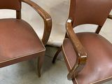 two chairs that are sitting next to each other